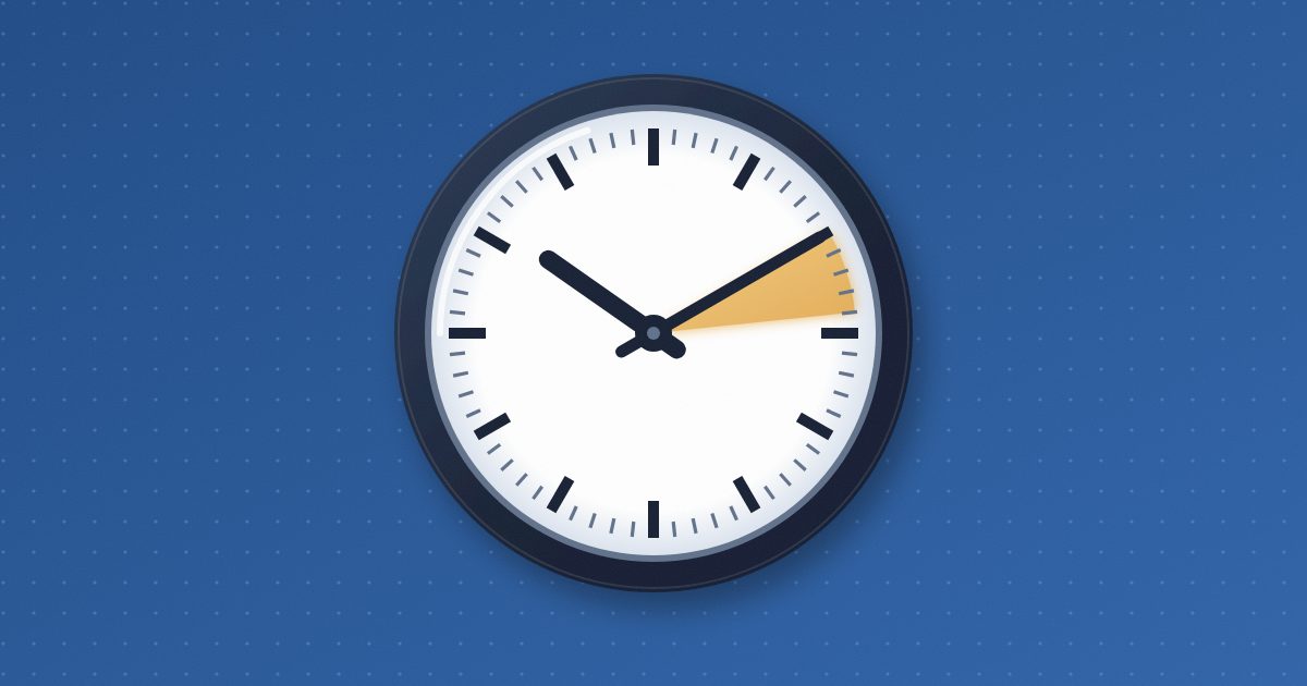 A plain hospital wall clock with tick marks and no numbers, a thin slice of a few minutes on its face glowing amber just ahead of the minute hand.