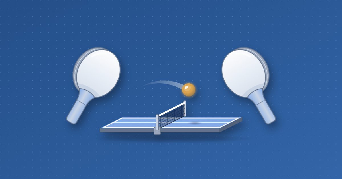 Two round table tennis paddles face each other across a low net on a table, a glowing amber ball in flight just above the net with a faint trail behind it.