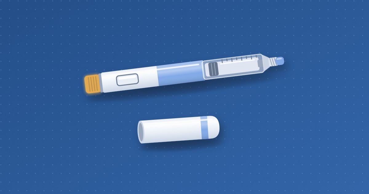 An insulin pen lying at a slight angle with its cap beside it, showing a clear cartridge window, a small capped hub at the tip and an amber dose knob.