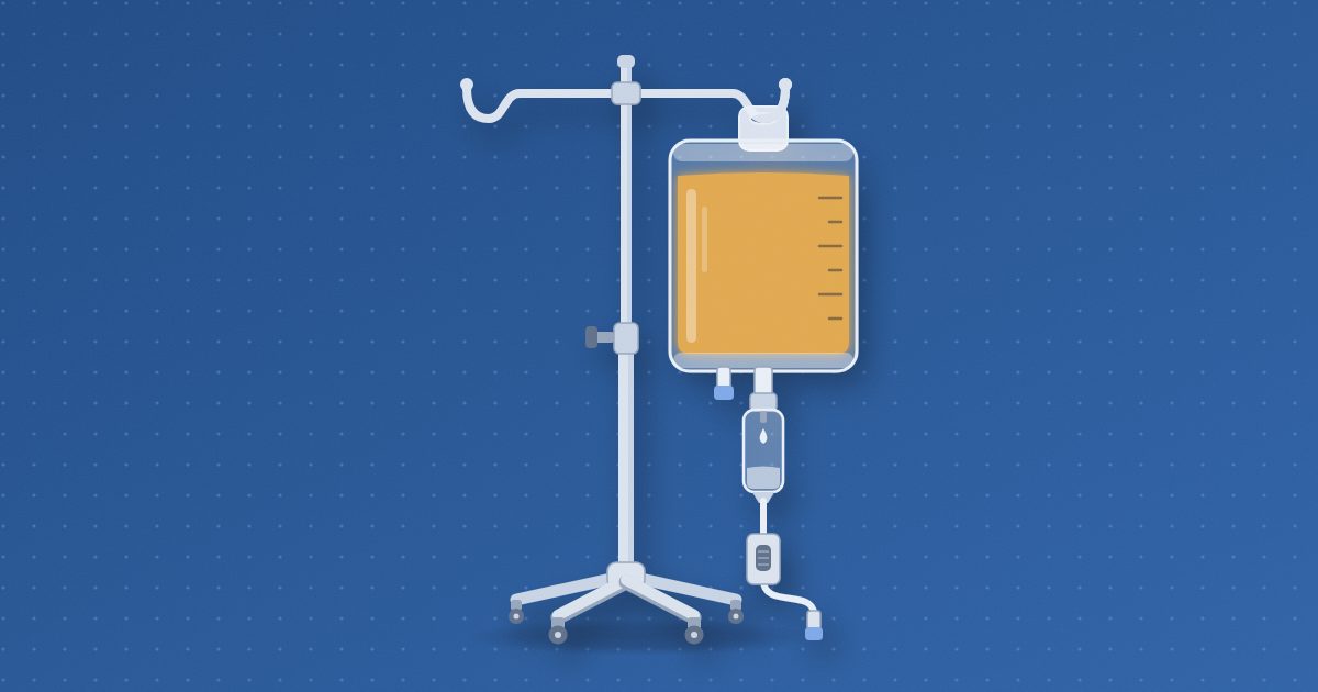 An infusion bag of amber fluid hanging from the hook of an IV pole, with a drip chamber, roller clamp and capped tubing below it.